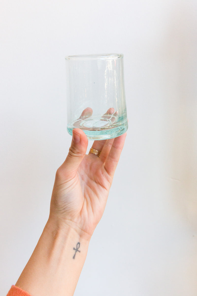 A person holding a glass from Verve Culture Moroccan Glassware